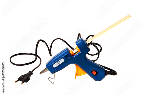Electric hot glue gun isolated on white.