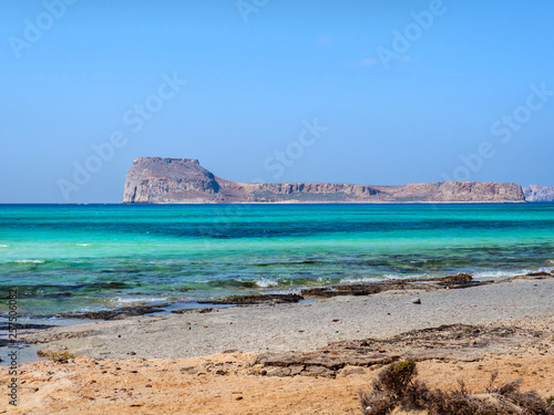 Empty beach and beautiful blue sea on the Balos beach overlooking the Gramvousa island