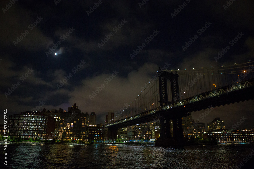 brooklyn bridge and manhattan at night