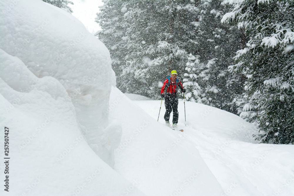 A man backcountry skiing above Red Mountain Pass, Silverton, Colorado. A man backcountry skiing above Red Mountain Pass, Silverton, Colorado.