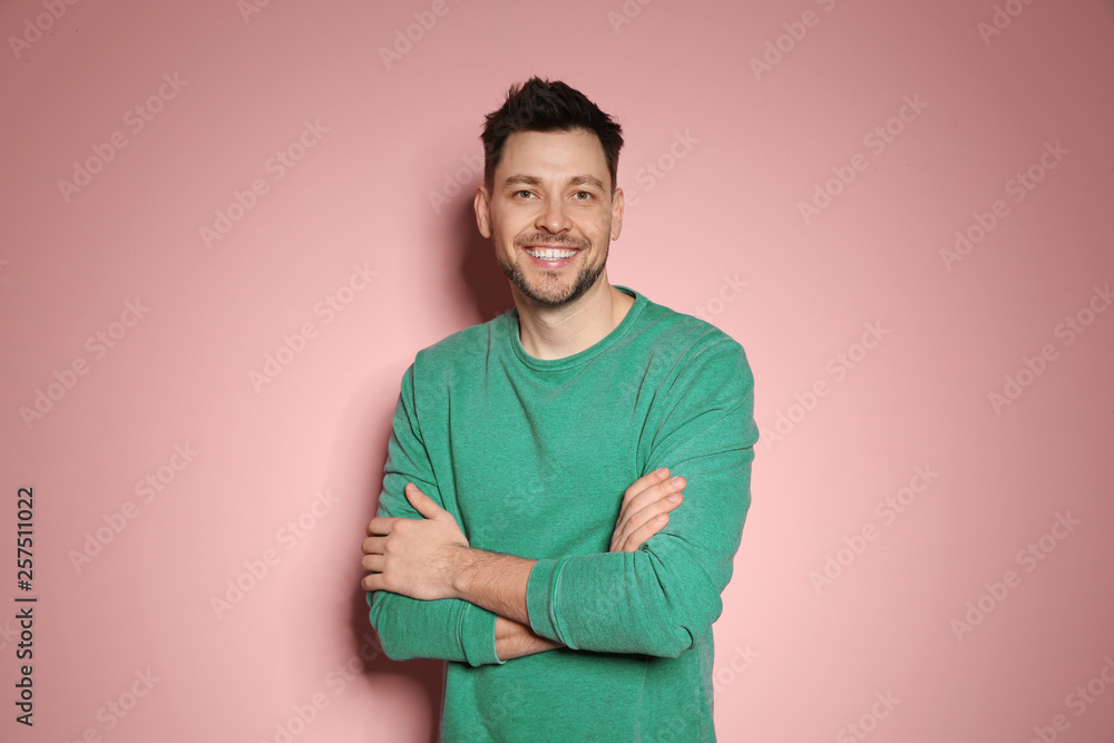 Portrait of handsome man in stylish clothes on color background Portrait of handsome man in stylish clothes on color background