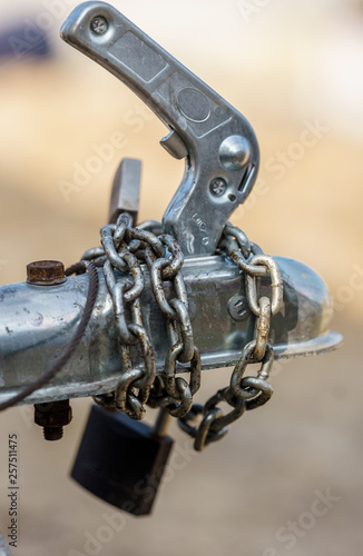 Padlock and chain on the trailer tow bar