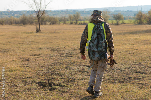 Hunters with a german drathaar and spaniel, pigeon hunting with dogs in reflective vests 