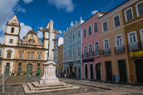 Stone cross in Cruzeiro de Sao Francisco Largo square with Sao Francisco Church and Convent in background, Salvador, Bahia, Brazil photo