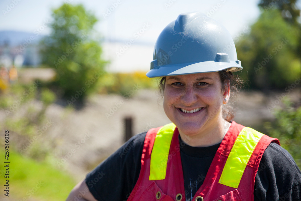 Portrait of a woman on a outdoor construction site. Portrait of a woman on a outdoor construction site.