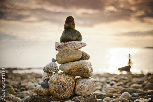 A large rock stack is built on a beach near Sechelt, BC, Canada.