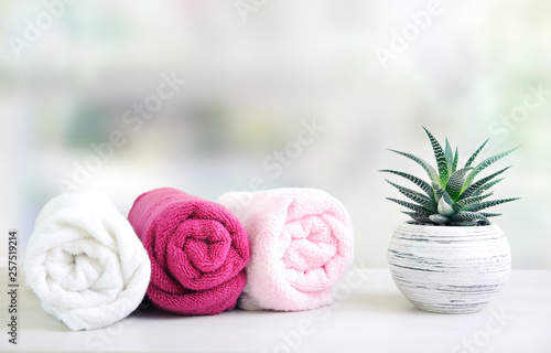 Rolled towels on table empty space background.