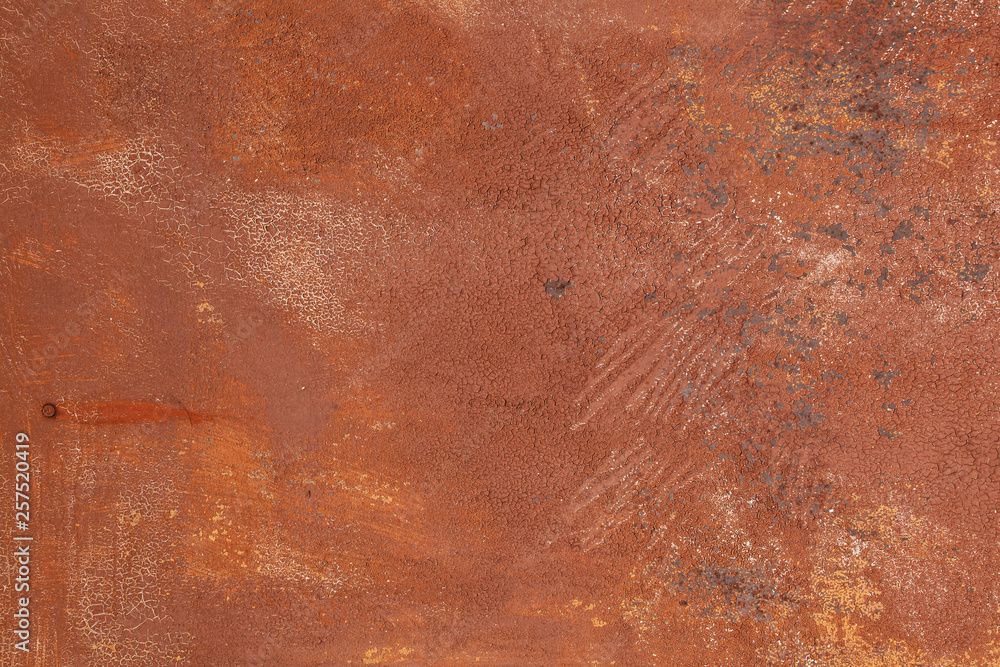 Rusty yellow-red textured metal surface. The texture of the metal sheet is prone to oxidation and corrosion. Textured background in grunge Style Rusty yellow-red textured metal surface. The texture of the metal sheet is prone to oxidation and corrosion. Textured background in grunge Style
