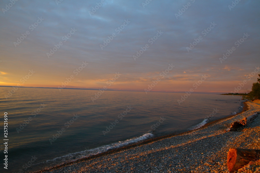 beautiful sunset on lake Baikal in summer, Vydrino village