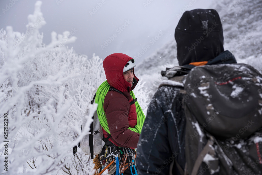 Client and guide walking out from day of ice climbing Client and guide walking out from day of ice climbing