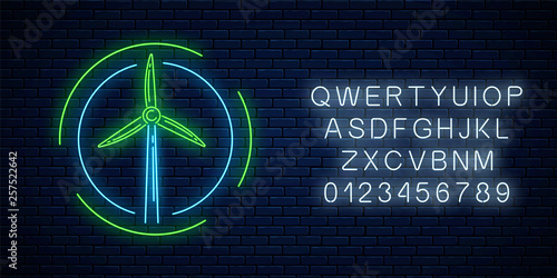 Glowing neon sign of windmill in circle frames with alphabet. Ecology wind power generation concept.
