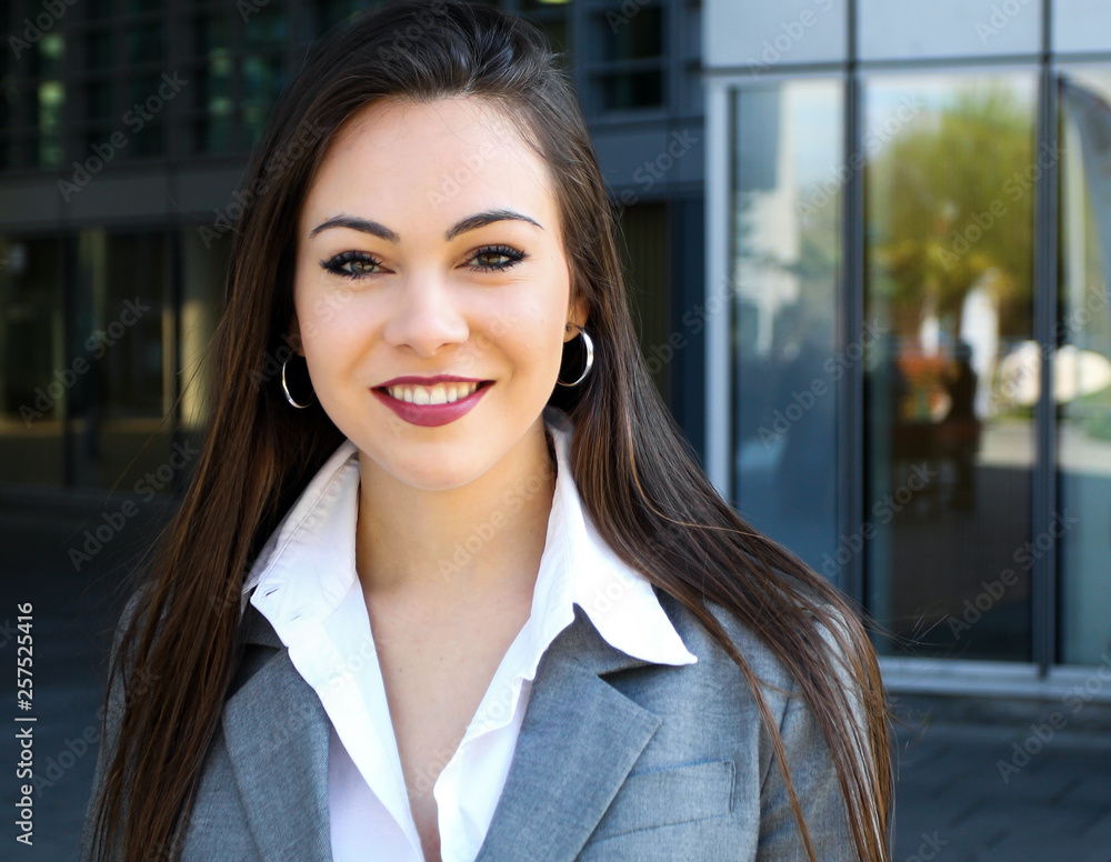 Confident young female manager outdoor in a modern urban setting Confident young female manager outdoor in a modern urban setting