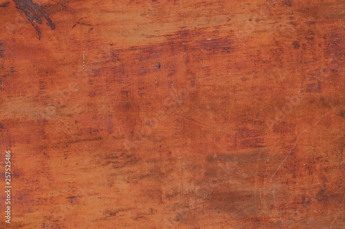 Rusty yellow-red textured metal surface. The texture of the metal sheet is prone to oxidation and corrosion. Textured background in grunge Style