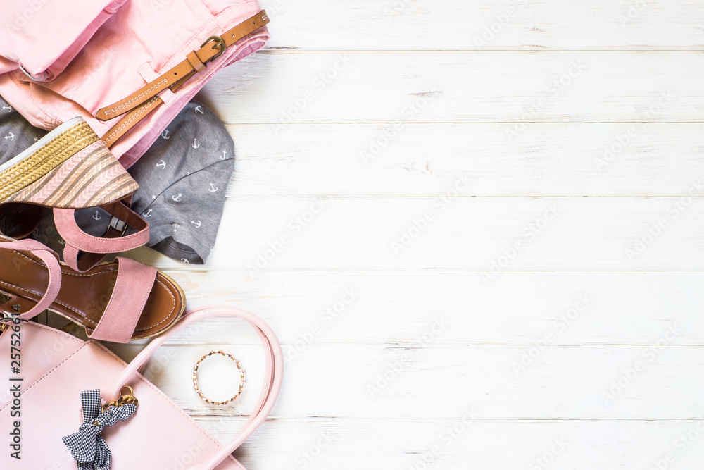 Woman clothes and accessories flat lay background Woman clothes and accessories flat lay background