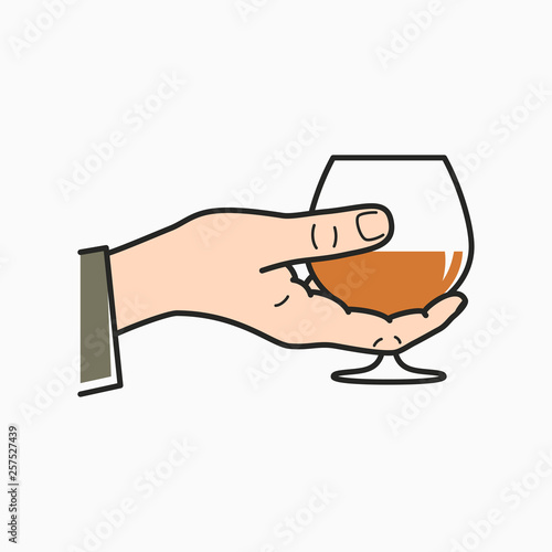 Hand hold cognac. Male hand holding brandy glass