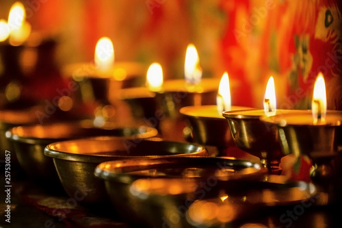 Close-up of butter lamps in Tengboche Monastery photo