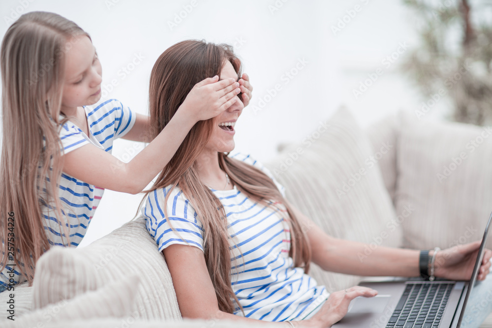 guess who. a little girl playing with her mother guess who. a little girl playing with her mother