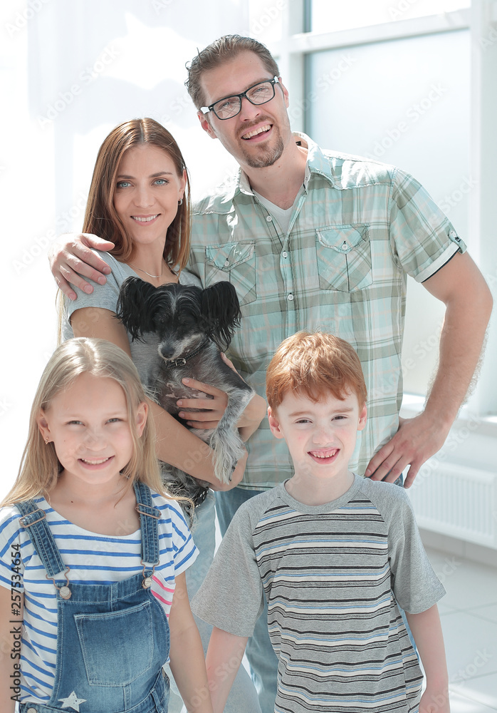 happy family on the background of a bright living room