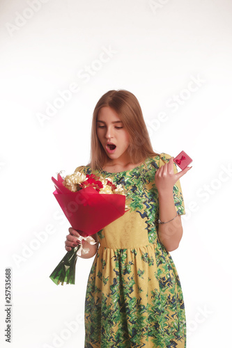 The portrait of an young blonde lady isolated over a white background photo