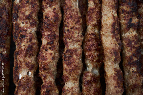 Shish kebab on a metal stick, top view. Lula kebab on skewers