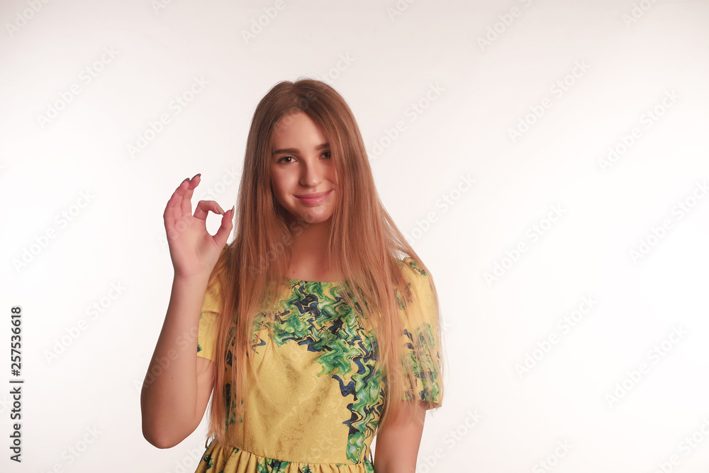 The portrait of an young blonde lady isolated over a white background The portrait of an young blonde lady isolated over a white background