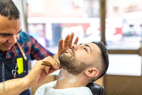 Young Man Getting a Beard Shaved