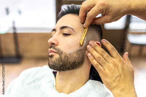 Young Man Getting a Beard Shaved