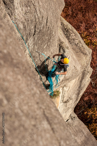 Lucas Iribarren belays his partner on the second pitch of a multipitch route in Cadarese, Ossola, Italy. photo