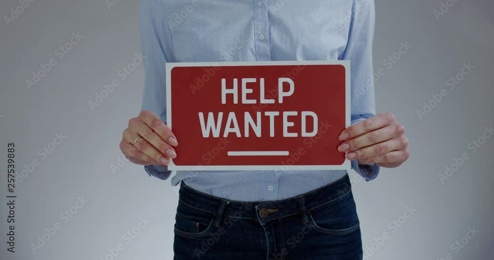 FIXED Attractive Caucasian female HR manager holding recruitment sign ...