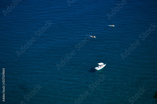 white boat in the sea blue ocean 
