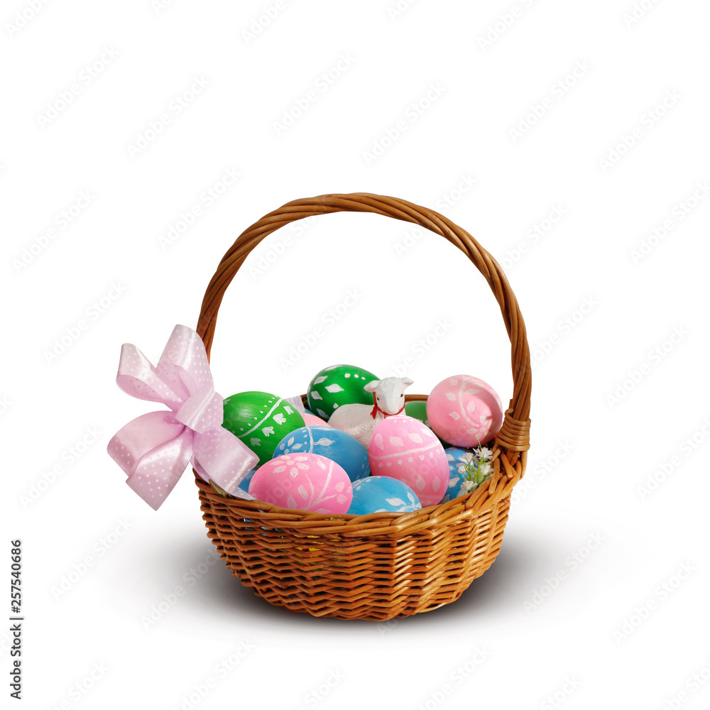 Colorful Easter eggs and lamb in an Easter basket Colorful Easter eggs and lamb in an Easter basket