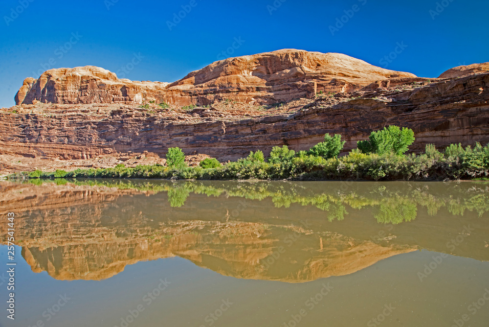 Water reflections and rafters on the Colorado River.