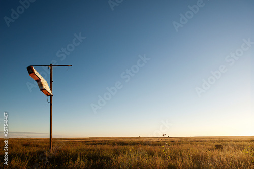 Old rusted motel sign sits alone on the open praire on north east New Mexico photo