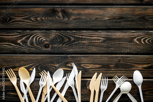 Принти на полотні Plastic utilization and the Earth protection concept with flatware on wooden bac