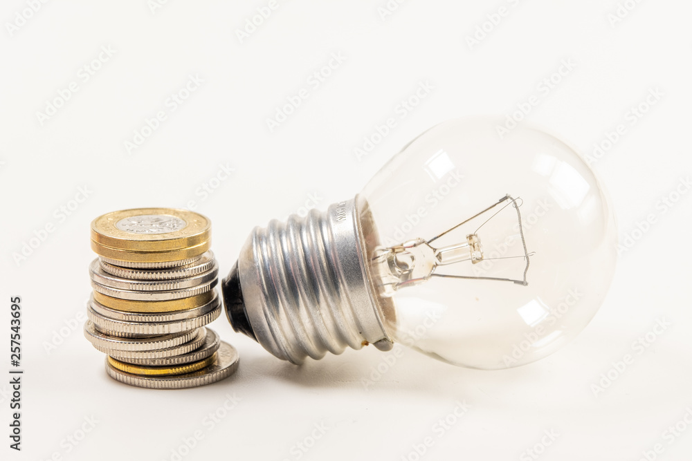Light bulb with heap of coins stairs for financial plan or business idea concept - Imagen Light bulb with heap of coins stairs for financial plan or business idea concept - Imagen