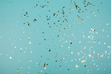 Golden sparkles on trendy background. Festive backdrop for your projects.