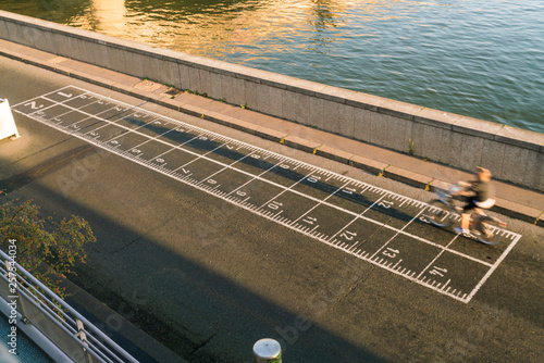 Biker on banks of the Seine River in Paris, Ile-de-France, France photo