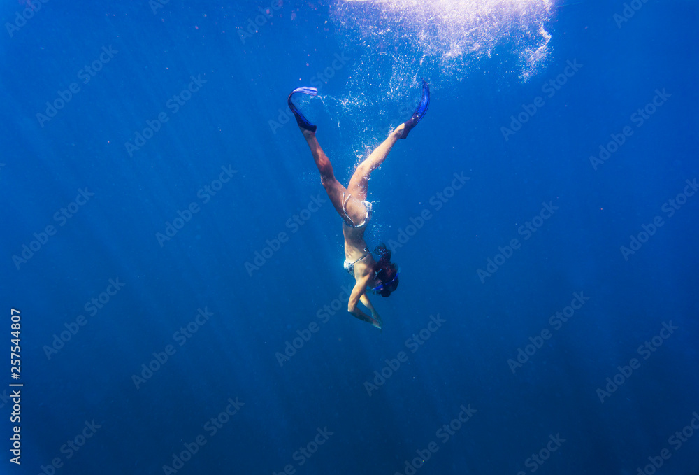custom made wallpaper toronto digitalYoung woman snorkeling in ocean.