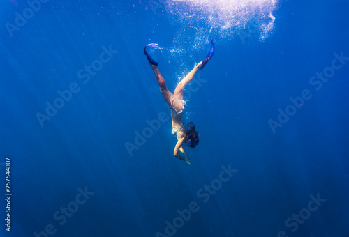 Wallpaper Mural Young woman snorkeling in ocean. Torontodigital.ca