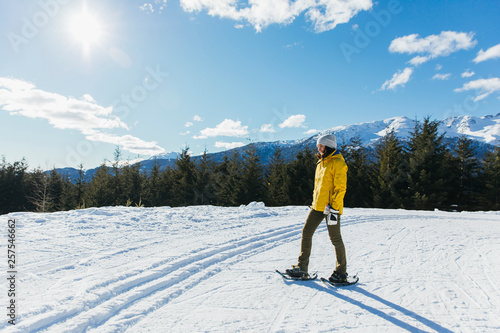 Woman snowshoeing, Whistler, British Columbia, Canada photo