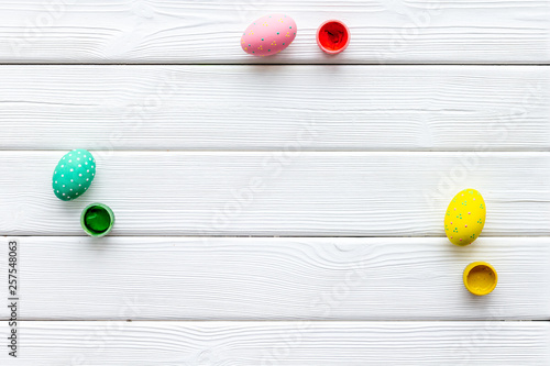 Traditional Easter eggs for paint on white wooden background top view space for text