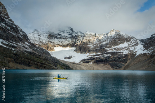 Kayaker in Lake O'Hara, Yoho National Park, Alberta, Canada photo