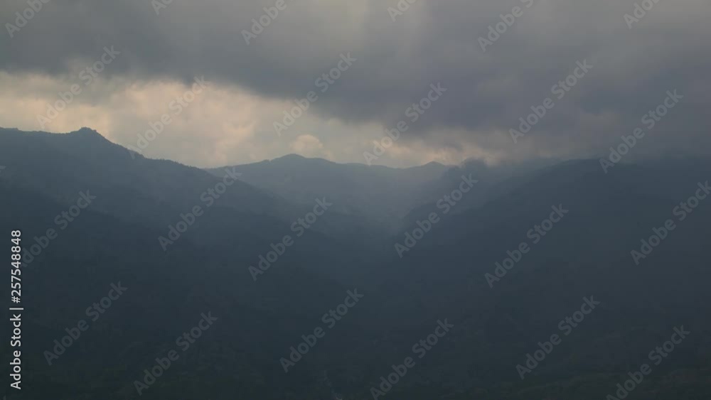 Rolling clouds moving over mountain landscape in Yakushima, Japan Rolling clouds moving over mountain landscape in Yakushima, Japan