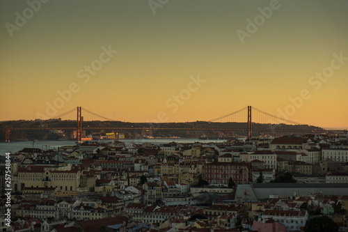 bridge and cityscape at sunset