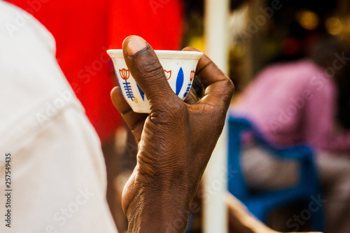 man holding a cup of coffee photo