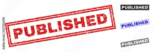 Grunge PUBLISHED rectangle stamp seals isolated on a white background. Rectangular seals with grunge texture in red, blue, black and gray colors.