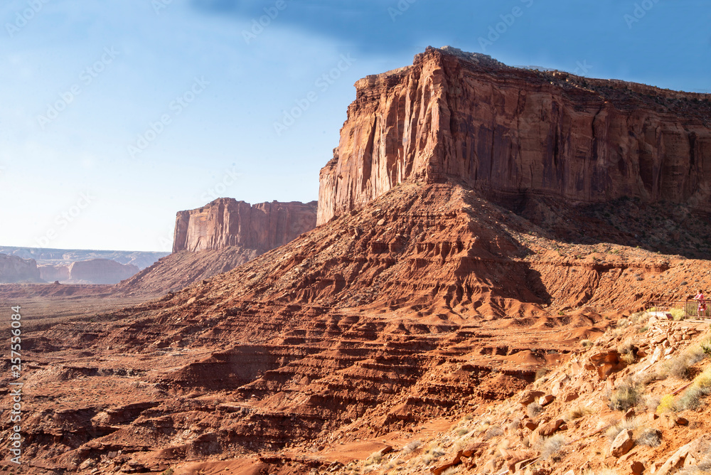 Fototapeta premium Monument Valley famous rock formations under a blue sky.