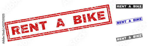 Grunge RENT A BIKE rectangle stamp seals isolated on a white background. Rectangular seals with distress texture in red, blue, black and grey colors.