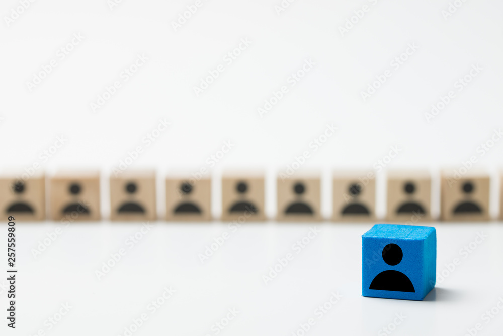 Leadership concept using blue people icon cube among many other cubes Leadership concept using blue people icon cube among many other cubes