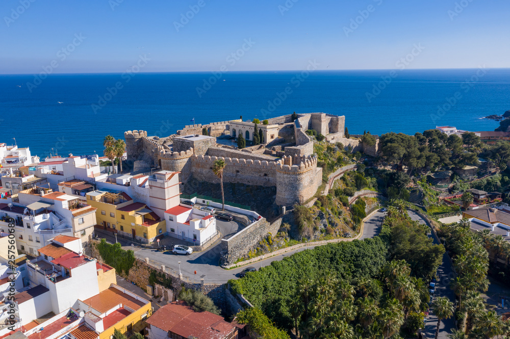 Almunecar aerial view of popular Mediterranean beach town with medieval castle in Spain